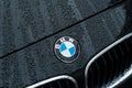 Rain drops on black BMW car front parked in the street Royalty Free Stock Photo