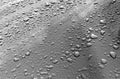 Rain drops on black and white metal surface. Royalty Free Stock Photo
