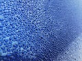 Rain drops at blue car body surface. Blue car body panel after rain Royalty Free Stock Photo