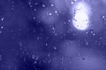 Rain drops with bokeh effect in the night city. Drops of rain on window with abstract lights Royalty Free Stock Photo