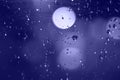 Rain drops with bokeh effect in the night city. Drops of rain on window with abstract lights Royalty Free Stock Photo