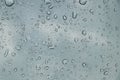 Rain drops on car front window in rainy day Royalty Free Stock Photo