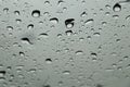 Rain drops on car front window in rainy day Royalty Free Stock Photo