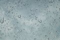 Rain drops on car front window in rainy day Royalty Free Stock Photo