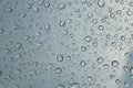 Rain drops on car front window in rainy day Royalty Free Stock Photo