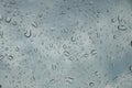 Rain drops on car front window in rainy day Royalty Free Stock Photo