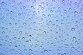 Rain drops on car glass. Gray blue background, toned Royalty Free Stock Photo