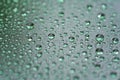 Rain drops on car glass with hydrophobic coating macro photo