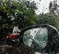 Rain drops on car mirror in rainy days Royalty Free Stock Photo