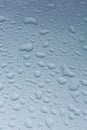 Rain drops on car with no glass coating protection Royalty Free Stock Photo