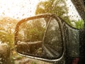 Rain drops on car side view mirror and window Royalty Free Stock Photo