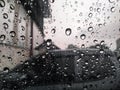 Rain drops on car windshield influence vehicle driving, storm weather forecast, rainy season Royalty Free Stock Photo