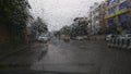 Rain drops on cars windshield during heavy monsoon rains in India