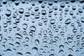 Rain drops cling to the car windshield, selective focus, soft focus