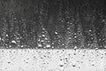 Rain drops close up on window glass outdoors. Texture of water in heavy rain. Gloomy autumn morning. Macro. Monochrome natural b Royalty Free Stock Photo