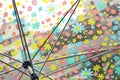 Rain drops on colorful flower umbrella Royalty Free Stock Photo
