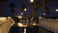 Rain drops, evening in Oceanside California USA. Pier, palms in twilight dusk. Reflection of light.