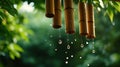 Rain drops falling from a bamboo wind chime, creating a gentle sound Royalty Free Stock Photo