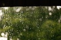 Rain drops falling from roof. Royalty Free Stock Photo