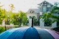 Rain drops falling on umbrella in the day time Royalty Free Stock Photo