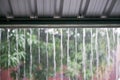 Rain drops fast dipping from zinc roof Royalty Free Stock Photo