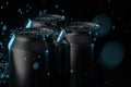 The rain drops fell on cans, cans with dark background, 3d rendering Royalty Free Stock Photo