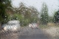 Rain drops on front car window, driving in heavy rain. Pouring rain, water drops on window. Concept of windshield not working, Royalty Free Stock Photo