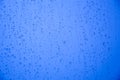 Rain drops on glass after rain. Abstract blue background Royalty Free Stock Photo