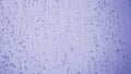 Rain drops on glass after rain toned in trendy Very Peri color of the year 2022. Abstract purple or violet background