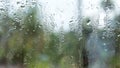 Rain drops on glass window. Raindrops falling from glass material. Abstract nature background. Copy space for text. Focus on Royalty Free Stock Photo