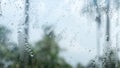 Rain drops on glass window. Raindrops falling from glass material. Abstract nature background. Copy space for text. Focus on Royalty Free Stock Photo