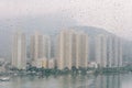 Rain drops on the glass windows with modern office building background Royalty Free Stock Photo