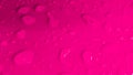 Rain drops on pink glossy background Royalty Free Stock Photo