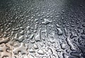 Rain drops on gray metal surface Royalty Free Stock Photo