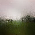 Rain drops on rainy day on outside window glass with blurred edges. Royalty Free Stock Photo