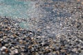 Rain drops rippling in a puddle Royalty Free Stock Photo