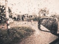 Rain drops on side glass of car while running on the road Royalty Free Stock Photo