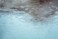 Rain drops on the surface of the water forming ripples Royalty Free Stock Photo