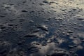 Rain drops on top of the dark car roof Royalty Free Stock Photo