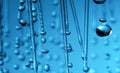 Rain drops of water close-up macro on a blue background Royalty Free Stock Photo