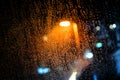 Rain drops on the window with dark streets outside Royalty Free Stock Photo