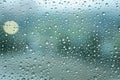 Rain drops on window glass on blue color Royalty Free Stock Photo