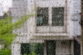 Rain drops on window glass with sky and tree in background. Royalty Free Stock Photo