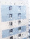 rain drops on window glass and view of urban house Royalty Free Stock Photo