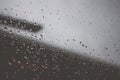 Rain drops on window glasses surface with cloudy background Royalty Free Stock Photo