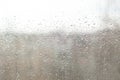 Rain drops on window glasses surface with cloudy background . Natural Pattern of raindrops Royalty Free Stock Photo