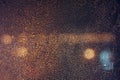 Rain drops on window with road light bokeh, City life in night in rainy season abstract background, water drop on the glass, night Royalty Free Stock Photo