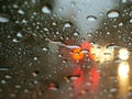 Rain drops on window with street bokeh lights. Royalty Free Stock Photo