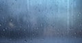 Rain drops on window surface. Rainy drops on windowpane over blurred city view. Wet grey glass backgound. Generated by artificial Royalty Free Stock Photo