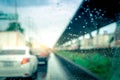 Rain drops on windshield. Car driving on asphalt road on rainy day. Windshield window of car with raindrops on glass windscreen. Royalty Free Stock Photo